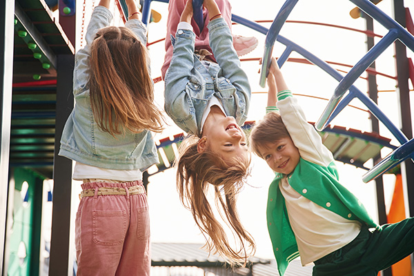 Kids playing on a playground.